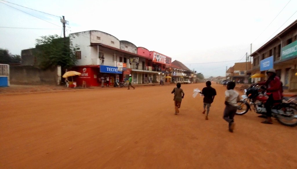 Giving sweets to street children in Kasese, Uganda.
